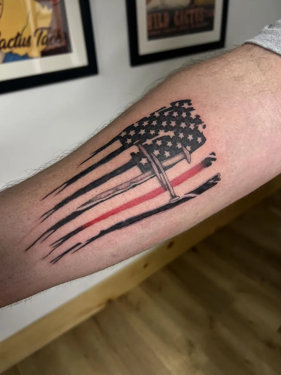 Distressed American flag with thin red line — forearm