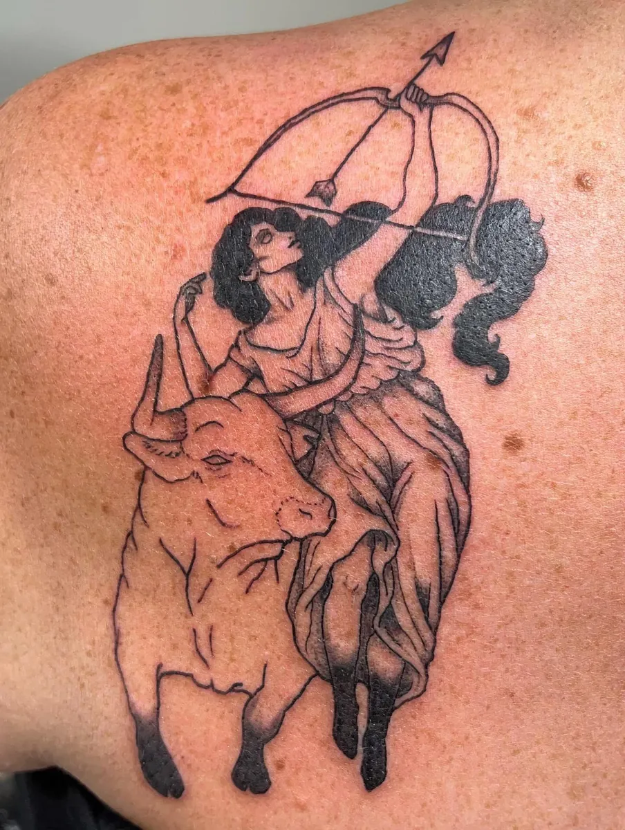 Mythological archer riding a bull — back