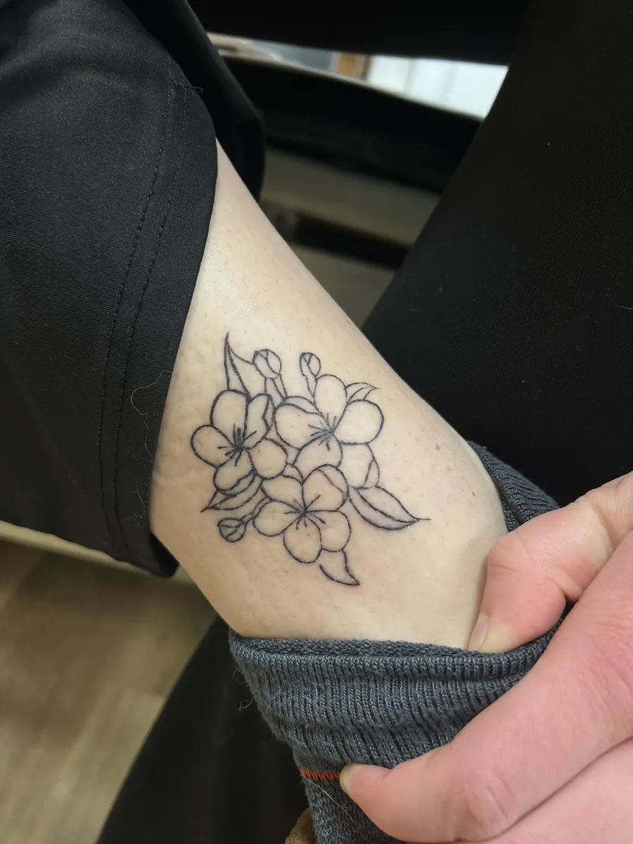 Cherry blossoms — fine line on the ankle