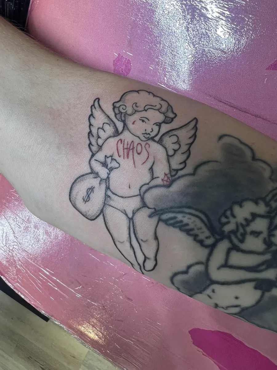 "CHAOS" cherub with money bag on the arm