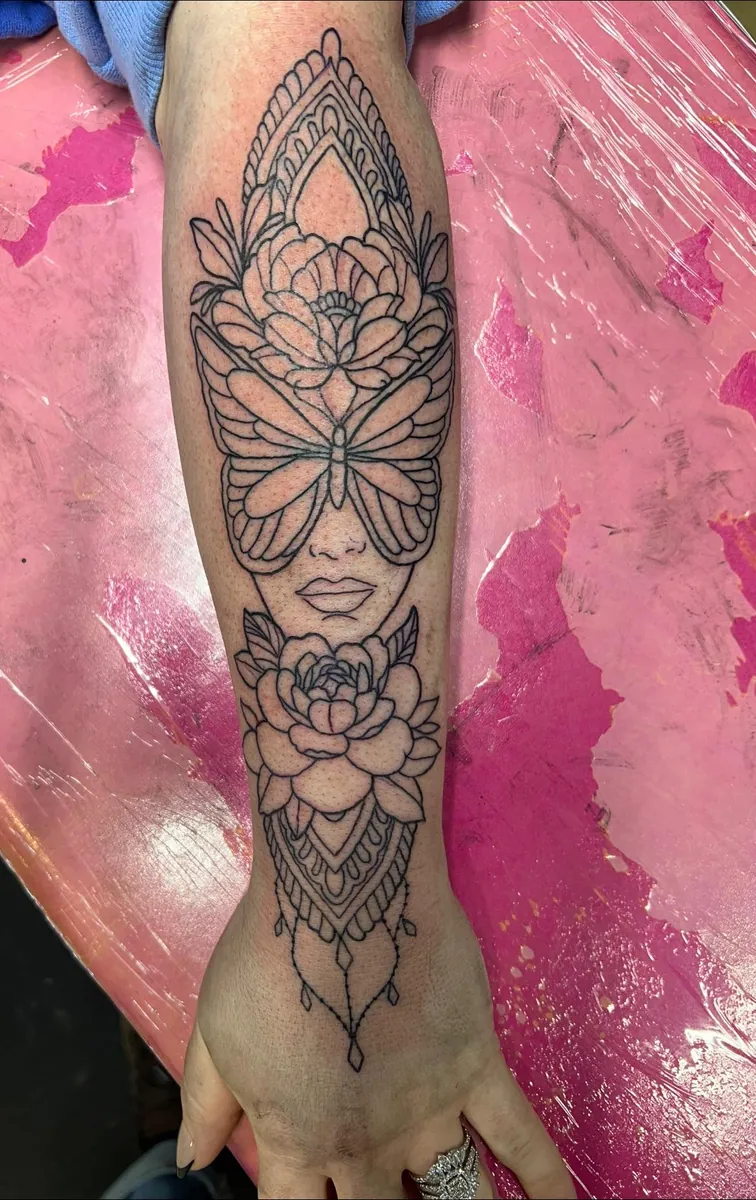 Woman's face, butterfly, peonies, mandala — forearm linework