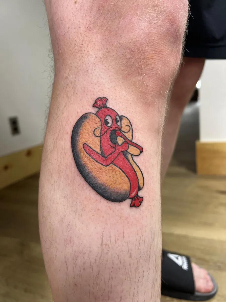 Cartoon hot dog character on calf — color
