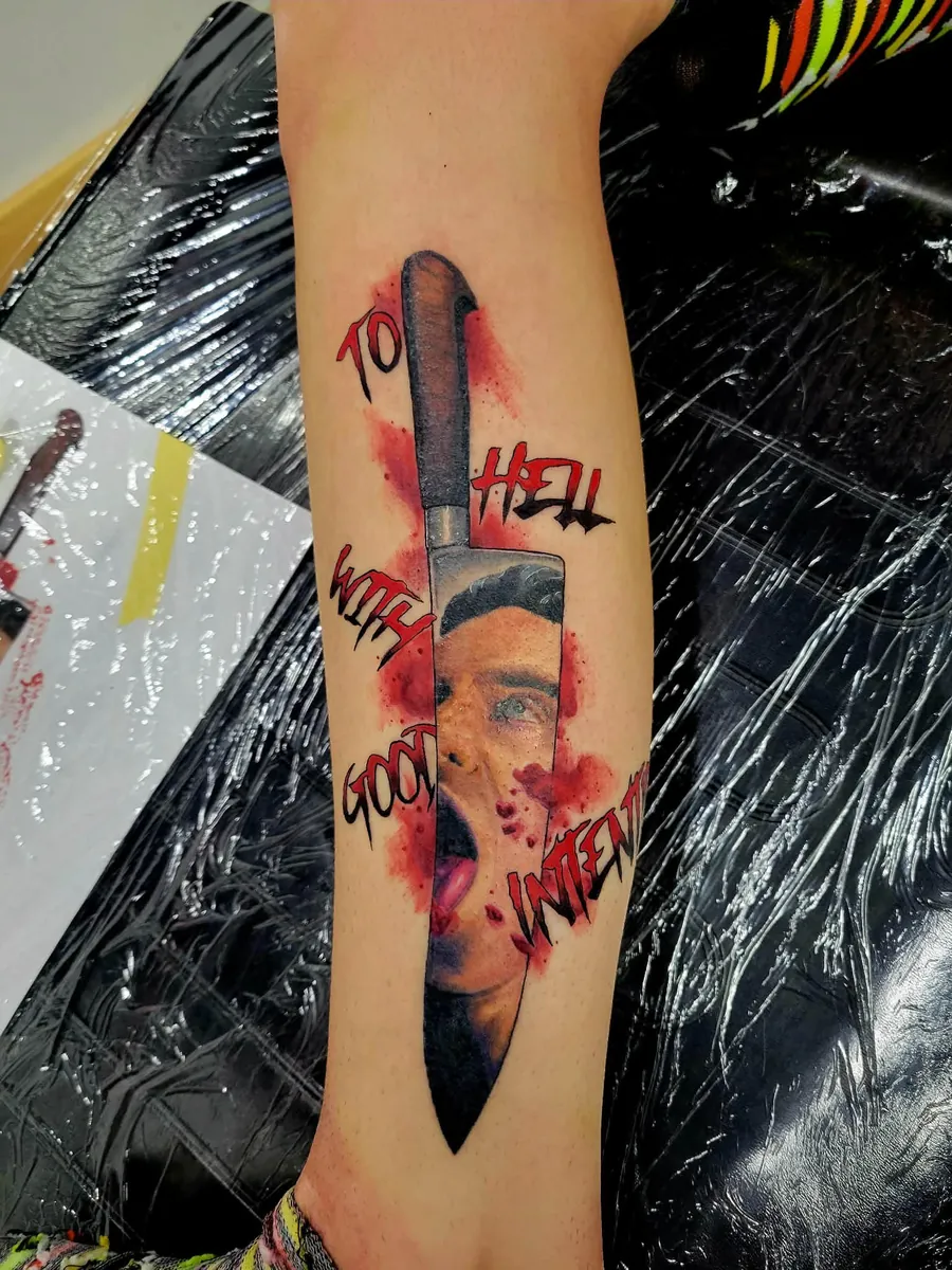 Knife with portrait — "TO HELL WITH GOOD INTENT" — arm