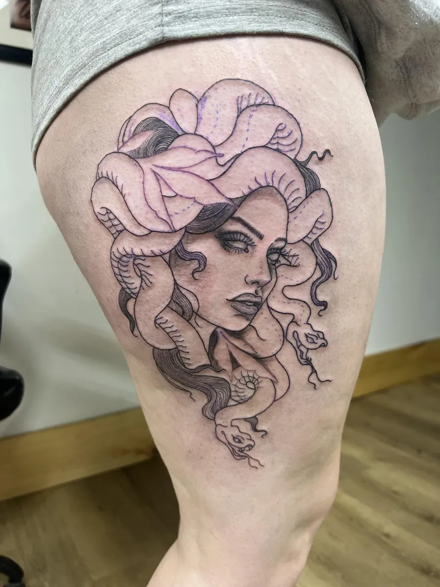 Medusa with snake hair — thigh linework