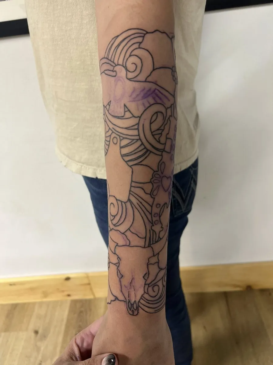 Sleeve in progress — ram skull, horns, swirl linework